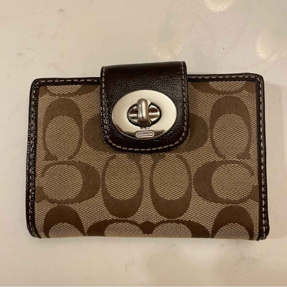 Coach Willie Turnlock has Brown and Tan Wallet